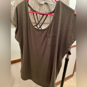 Green shirt with gold polka dots